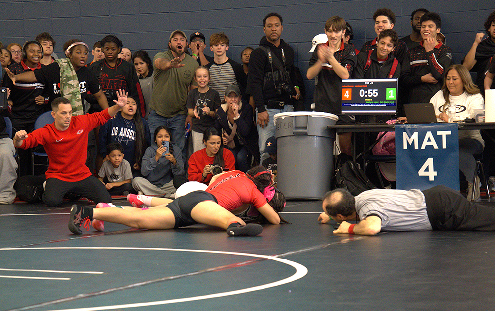 115 lb. Aviana Caceres putting the finishing touch on a get-back win.