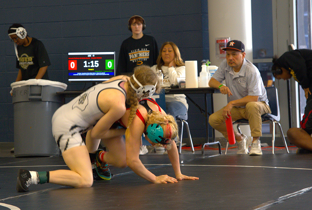 125 lb. champ Kayla Dunn working on breaking down her opponent