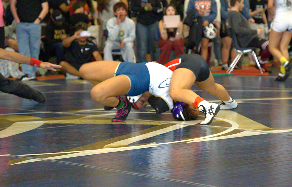 130 lb. Lianna Benitez getting the pin of Gabriella Martinez