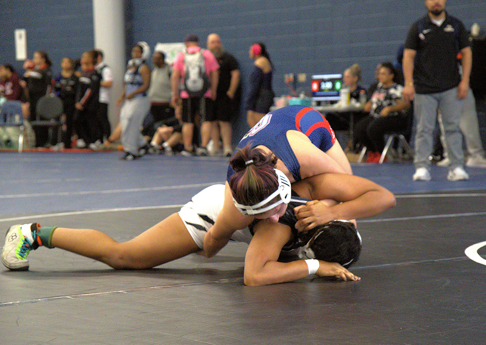 145 lb. champ Alyssa Navarro turning her opponent