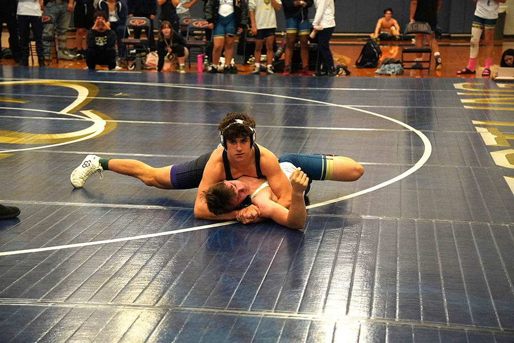 165 lbs. John Humphries in for the pin
