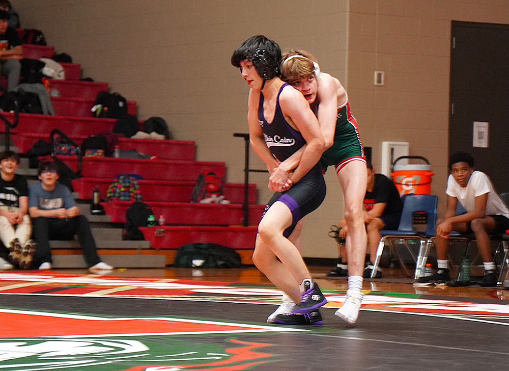 Alex Riggle of Klein Cain working to escape from The Woodlands' Nathan Duchmasclo