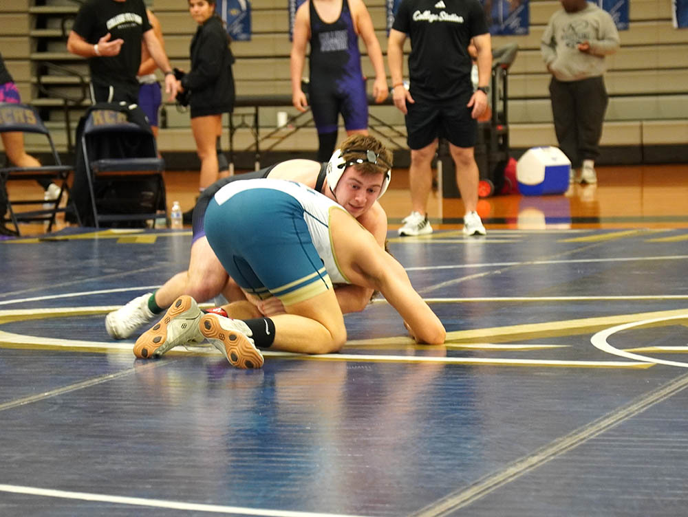 Elias Haenke (CS) setting the cradle on Noah Patterson (KC)