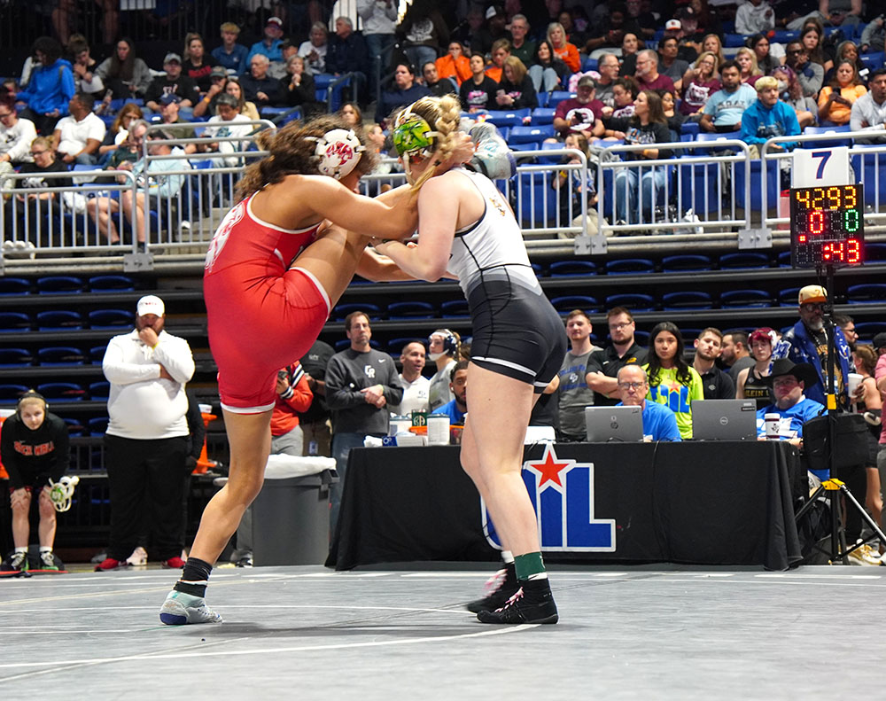 Avery Fitzgerald with a hold of Haley Pitts_ leg